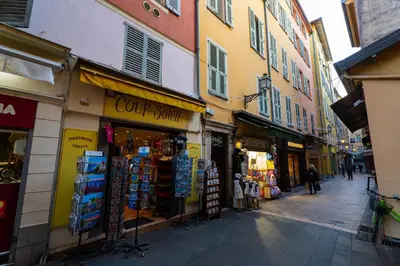 a street with shops and buildings in a city at La Casa Nissa in Nice
