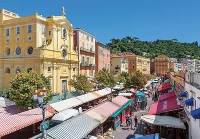 a city street with a bunch of shops and buildings at La Casa Nissa in Nice