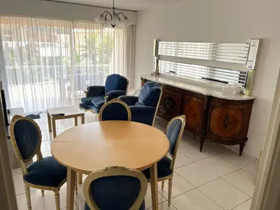 a white bathroom with a toilet and a sink at Charming 2-room near beach with terrace in Cagnes-sur-Mer