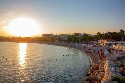 a group of people in the water at a beach at Studio Lavande cosy et central à Cagnes-sur-Mer in Cagnes-sur-Mer