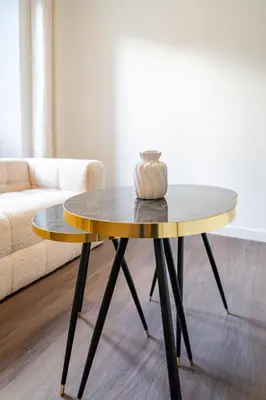 a coffee table in a living room next to a couch at Appartement cosy au coeur de Cagnes sur Mer in Cagnes-sur-Mer