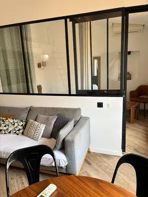 a living room with a couch and a table at Magnifique 2P Vieux Nice AC-WIFI in Nice