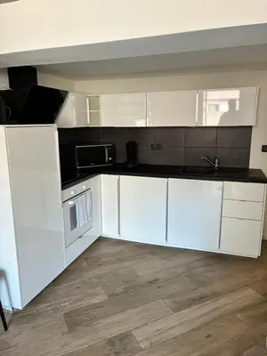 a kitchen with white cabinets and a microwave at Magnifique 2P Vieux Nice AC-WIFI in Nice