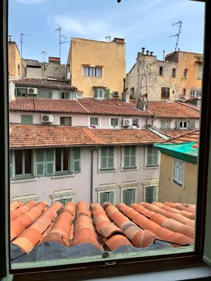 a view of roofs of buildings from a window at Magnifique 2P Vieux Nice AC-WIFI in Nice
