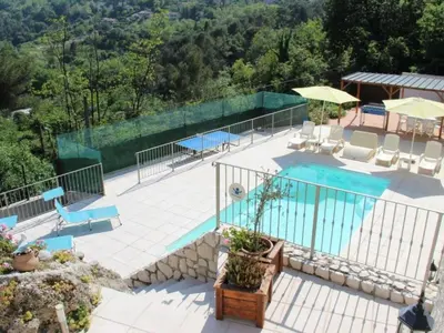 a swimming pool with a view of a resort at Holiday Home Rocabel mit Blick auf das Wasser by Interhome in Gattières