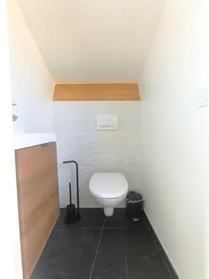 a bathroom with a white toilet in a room at Elegant Renovated Apartment Nice Port AC Sleeps 4 in Nice