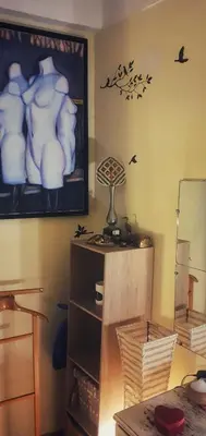 a room with a picture of birds on the wall at Shared Appartment with Kitten in Nice