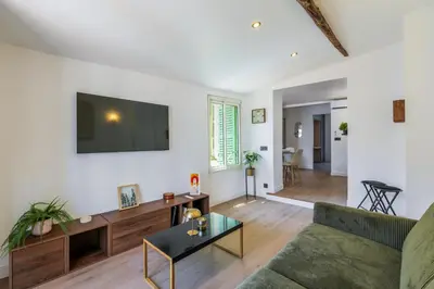 a dining room with a glass table and chairs at Bright 3 rooms apartment close to Place Massena in Nice