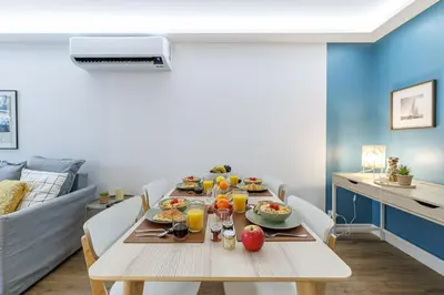 a dining room with a table with food on it at MY CASA - SUISSE - Cosy Apartment Down Town with terrasse in Nice