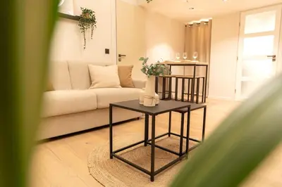 a living room with a couch and a table at Charmant Duplex Vieux Nice, proche mer, WiFi, Clim in Nice