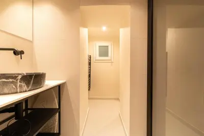 a bathroom with a sink and a shower at Charmant Duplex Vieux Nice, proche mer, WiFi, Clim in Nice