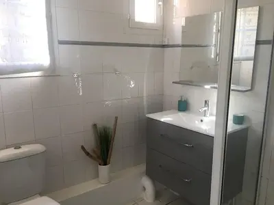 a white bathroom with a sink and a toilet at Studio cosy proche des plages & promenade in Nice