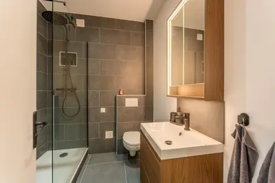 a bathroom with a sink and a toilet and a shower at Bright apartment in Nice in Nice