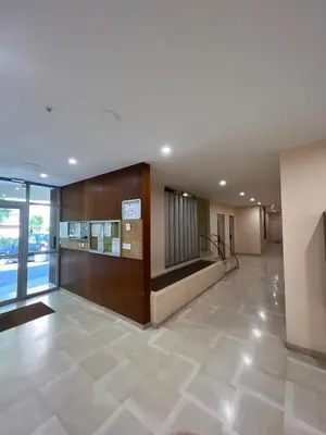 a lobby of a building with a staircase and a lobby at Sea view appartment in Nice