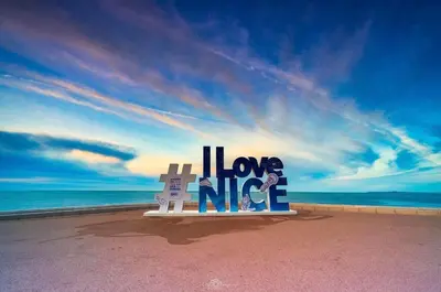a sign that says i love the nike on a beach at Sea view appartment in Nice