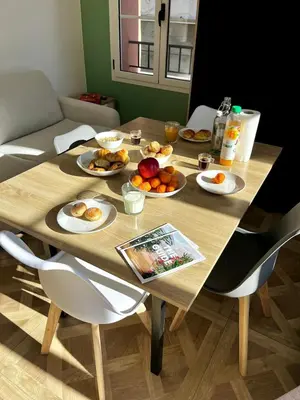a wooden table with plates of food on it at Studio Olivier avec terrasse à Cagnes-sur-Mer in Cagnes-sur-Mer