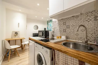 a kitchen with a sink and a washing machine at Cozy Apartment a-c 1BR-2P - Nice in Nice