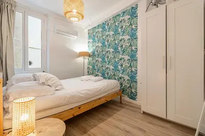 a small bedroom with a bed and a window at Cozy Apartment a-c 1BR-2P - Nice in Nice