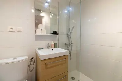 a bathroom with a toilet and a sink and a shower at Cozy Apartment a-c 1BR-2P - Nice in Nice