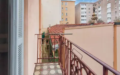 a balcony of a building with a bird on it at T2design, élégant & calme à Nice in Nice