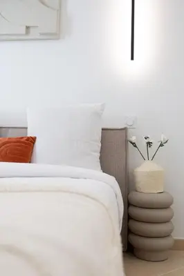 a bedroom with a bed and a vase with flowers at Coup de cœur 3 couchages Quartier du Port in Nice