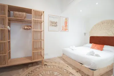 a bedroom with a bed and a book shelf at Confort, modernité & calme au Port de Nice in Nice
