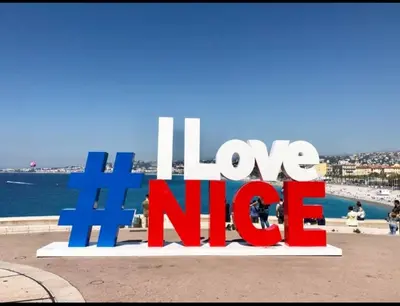 a sign that says love nicole in front of the ocean at Confort, modernité & calme au Port de Nice in Nice