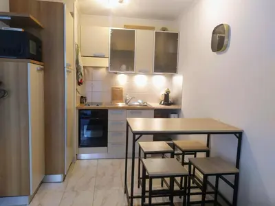 a microwave on top of a refrigerator in a kitchen at WeHost BARETY - Blooming Balcony Retreat - Central 3-4prs in Nice