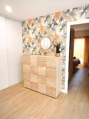a living room with a mirror on a wall at Havre de paix à Nice Cimiez -T4 en rez-de-jardin in Nice