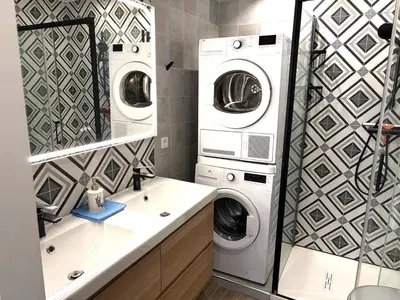 a bathroom with two washing machines and a sink at Hyper centre massena in Nice