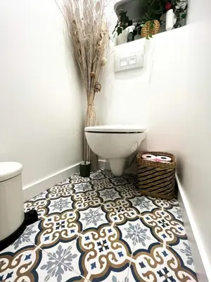 a bathroom with a toilet on a tile floor at Nice Boheme in Nice