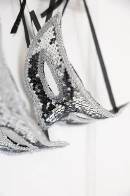 a pair of silver earrings on a wall at Duplex moderne climatisé Carré d'or in Nice