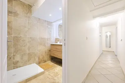 a bedroom with a blue bed and a ladder at Appartement charmant & cosy au cœur du Vieux Nice in Nice