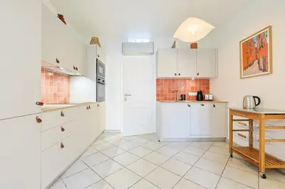 a kitchen counter with a sink and a coffee maker at Appartement charmant & cosy au cœur du Vieux Nice in Nice