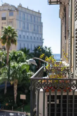 a balcony with plants on it in a city at La Perle de Masséna in Nice