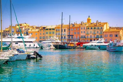 a group of boats docked in a harbor with buildings at Living Nice and French Riviera in Nice