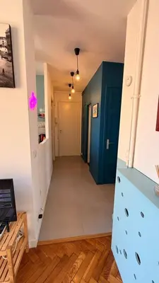 a hallway in a house with a blue door at Living Nice and French Riviera in Nice