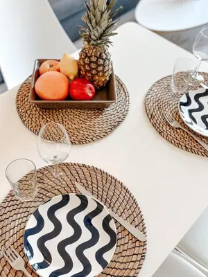 a table with two plates of fruits and a tray of pineapple at Elegant Apartment with Balcony, Central Nice in Nice