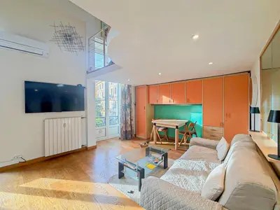 a living room with a couch and a table at Place Grimaldi - Wifi, AC, 3pers in Nice