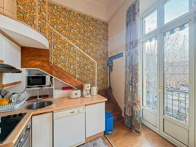 a small kitchen with a sink and a window at Place Grimaldi - Wifi, AC, 3pers in Nice