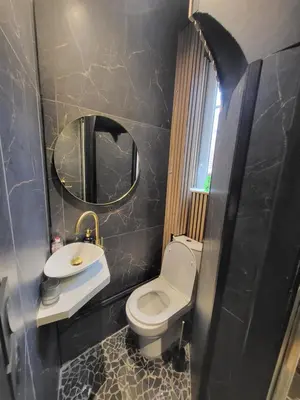 a bathroom with a toilet and a sink and a mirror at Studio Cosy Mezzanine 2-4p Carré d'Or in Nice