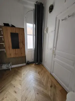 an empty room with a door and a wooden floor at Studio Cosy Mezzanine 2-4p Carré d'Or in Nice