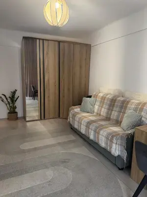 a living room with a bed and a sliding door at Studio Lumiere Nice Center in Nice
