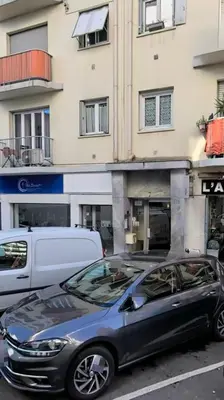 a black car parked in front of a building at Studio Lumiere Nice Center in Nice