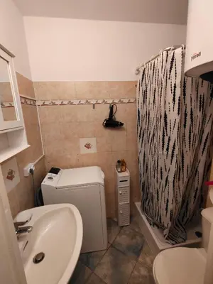 a small bathroom with a toilet and a sink at Good studio in Nice