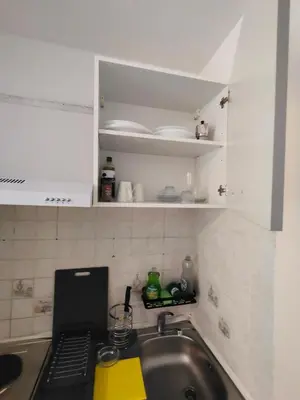 a kitchen with a sink and a counter top at Good studio in Nice