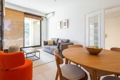 a living room with a table and a couch at Perfect Location downtown - elegant apartment in Nice