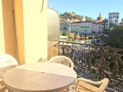 a white table and chairs on a balcony with a view at Perfect Location downtown - elegant apartment in Nice