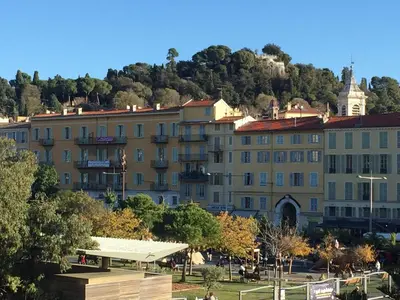 a large building in front of a mountain at Perfect Location downtown - elegant apartment in Nice