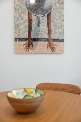 a dog standing on a table next to a bowl at Perfect Location downtown - elegant apartment in Nice